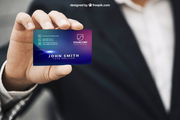 Free Man Holding Business Card Mockup Psd