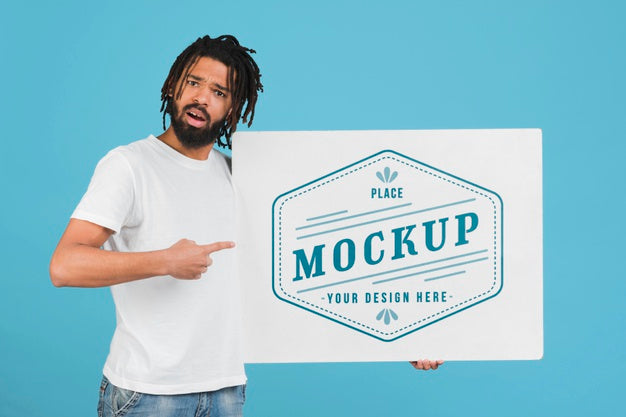 Free Man Holding Poster Mockup Psd