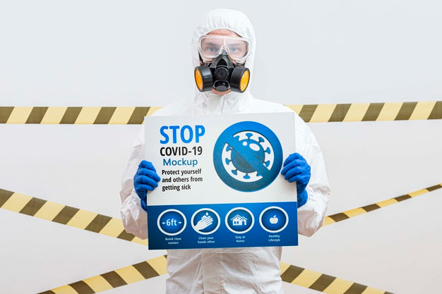 Free Man In Hazmat Suit Holding A Stop Coronavirus Mock-Up Psd