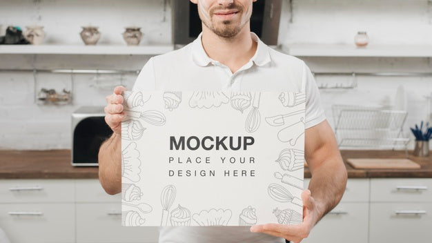 Free Man In The Kitchen Holding Blank Placard Psd