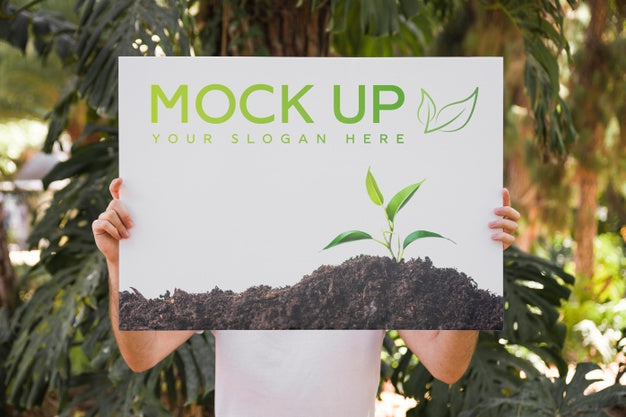 Free Man Presenting Poster Mockup In Front Of Park Psd