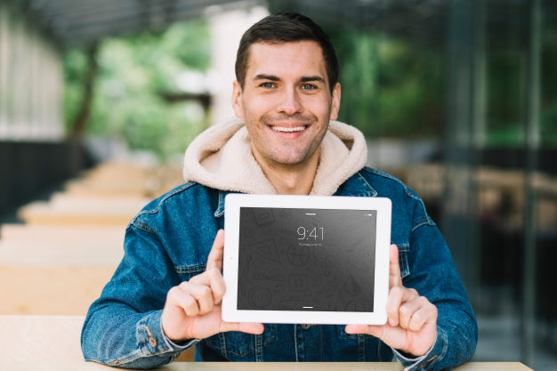 Free Man Presenting Tablet Mockup Psd