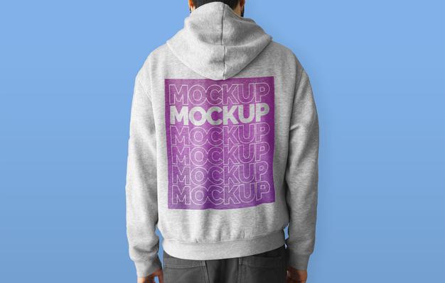 Free Man Wearing A Hoodie Mockup Psd