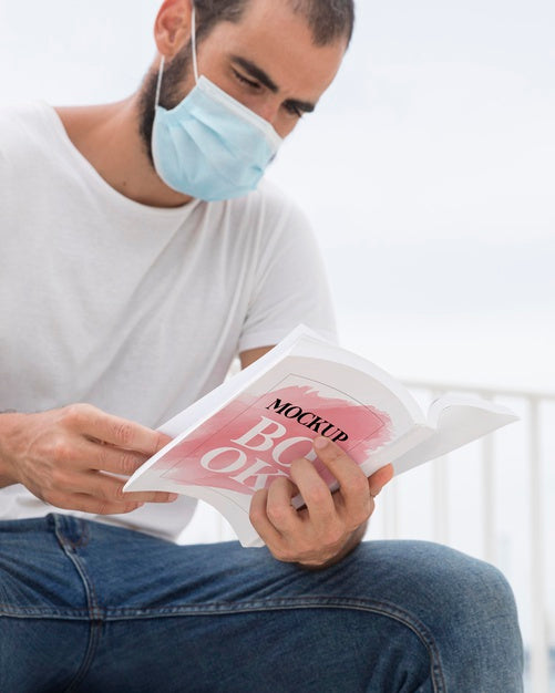 Free Man With Mask On Street Reading Book Psd