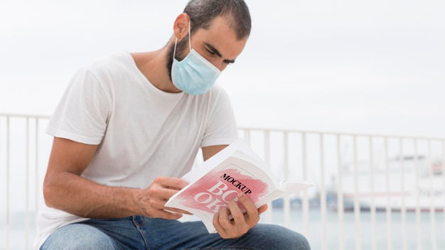 Free Man With Mask On Street Reading Book Psd