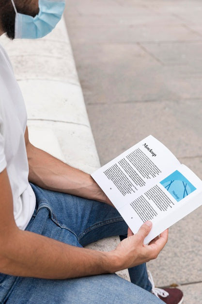 Free Man With Mask On Street Reading Book Psd