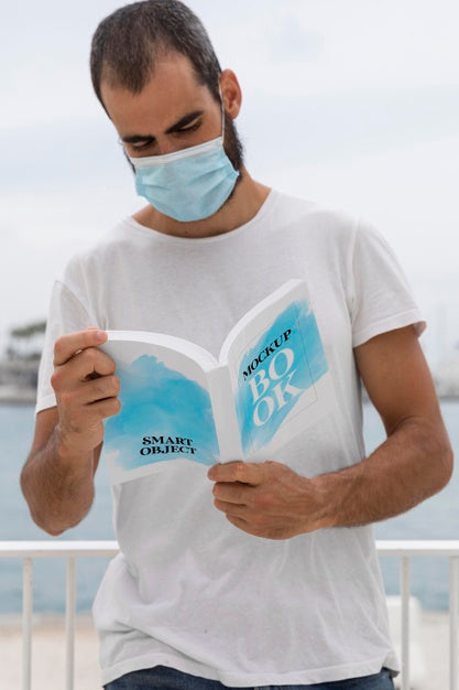 Free Man With Mask On Street Reading Book Psd