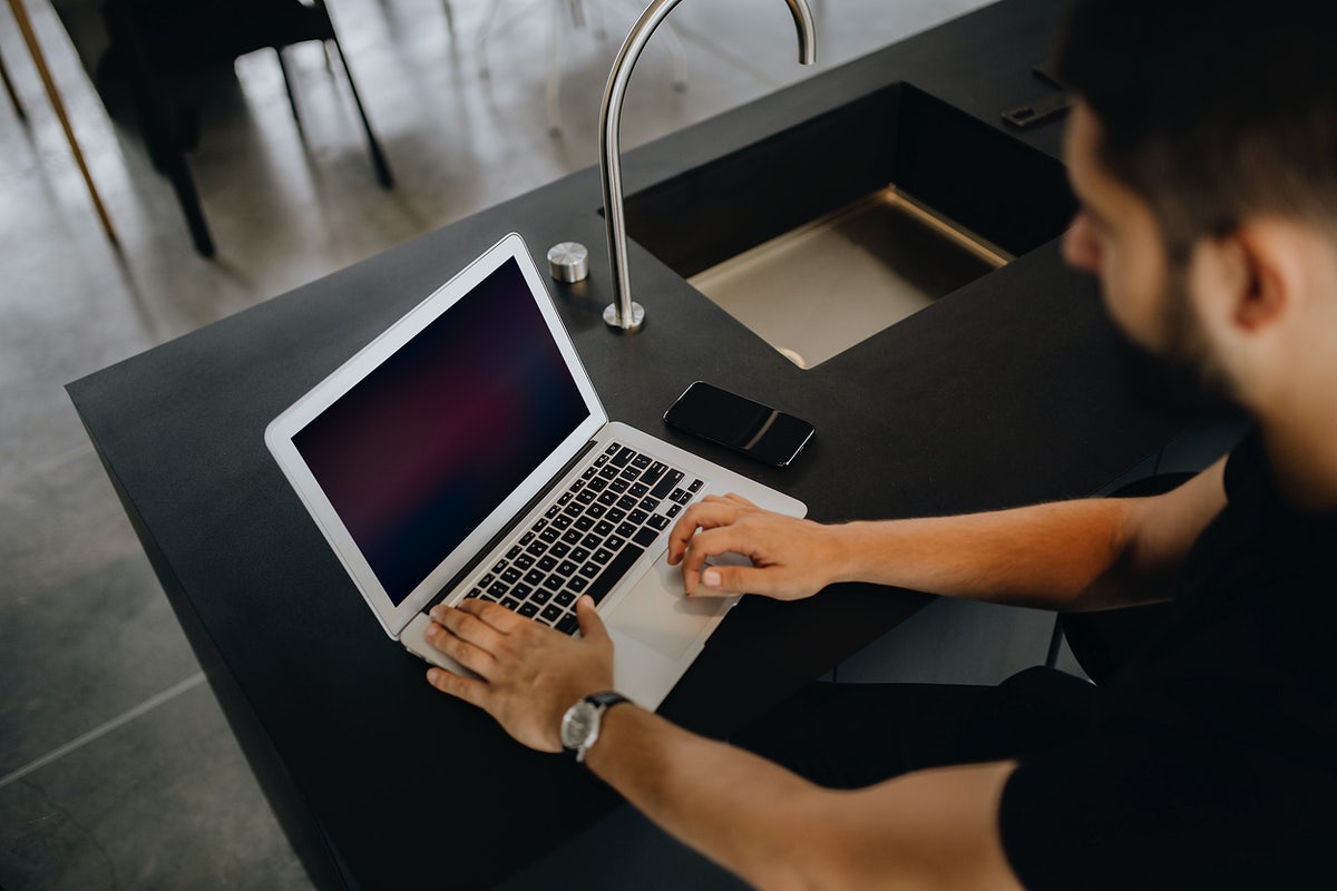 Free Man Working On A Laptop