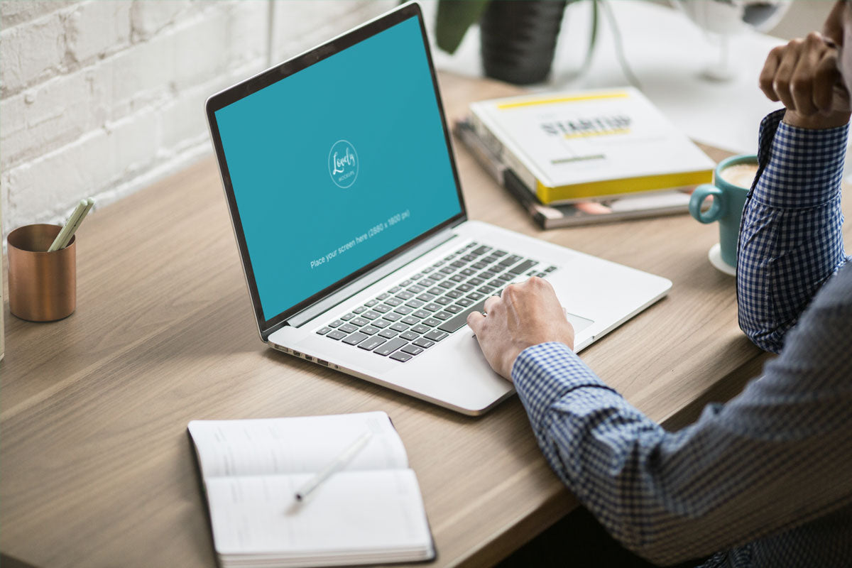 Free Man Working On His Macbook Pro Mockup