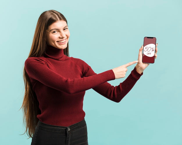 Free Medium Shot Happy Girl Pointing At Her Phone Psd