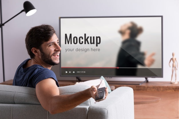 Free Medium Shot Smiley Man Watching Movie On Tv Psd