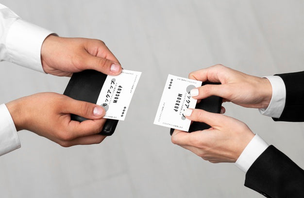 Free Men Holding Business Cards Mock-Up Psd