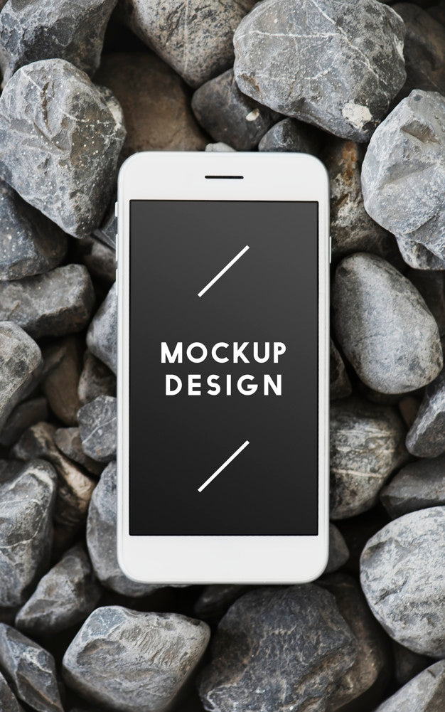 Free Mobile Phone On A Rocky Surface Psd