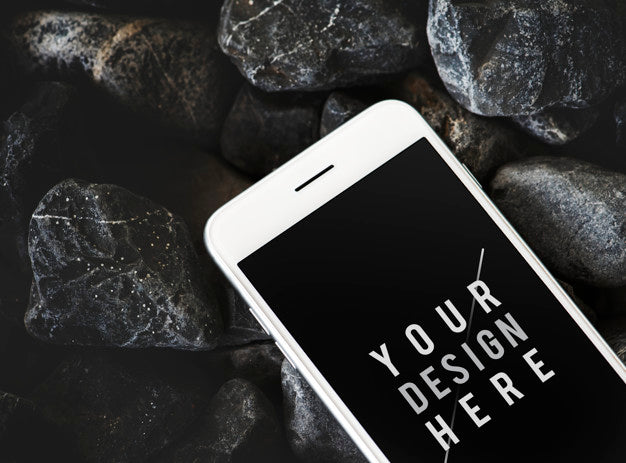 Free Mobile Phone On A Rocky Surface Psd