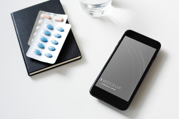 Free Mobile Phone With Pills On The Table Psd