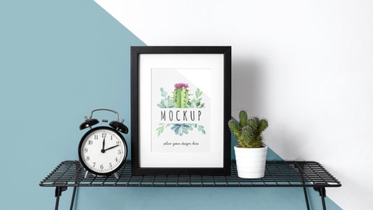 Free Mockup Frame On Table Beside Clock Psd