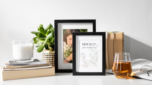 Free Mockup Frame On Table Beside Plants Psd