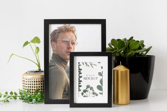 Free Mockup Frame On Table Beside Plants Psd