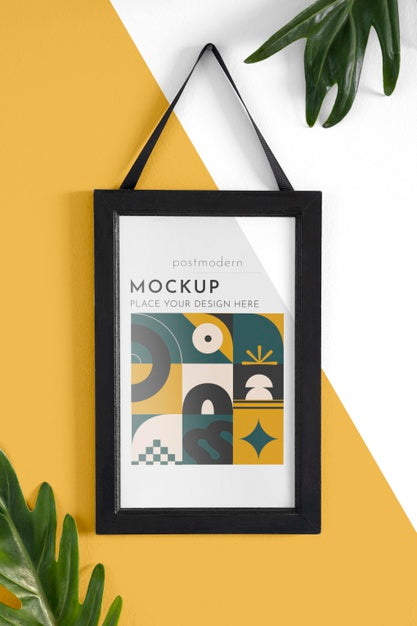 Free Mockup Frame On Wall With Leaves Psd