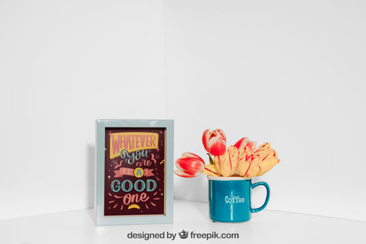 Free Mockup Of Frame Next To Blue Mug Psd