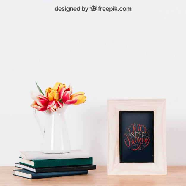 Free Mockup Of Frame Next To Three Books Psd