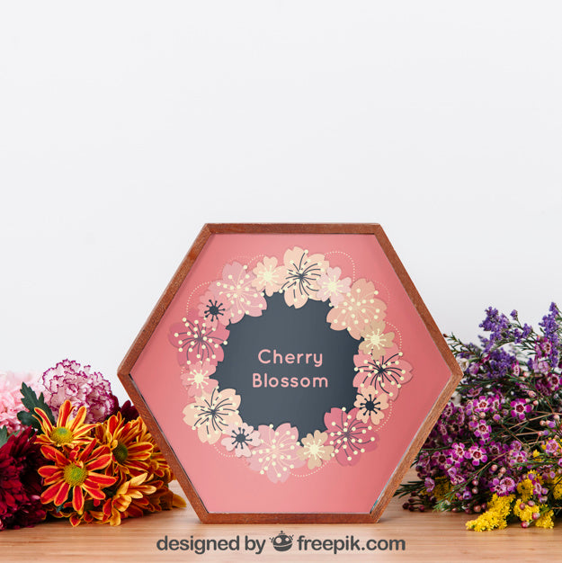 Free Mockup Of Hexagonal Frame Between Flowers Psd