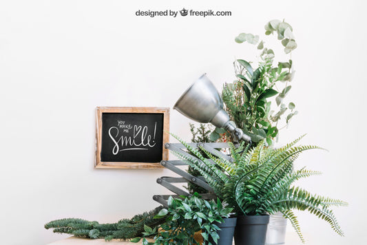 Free Mockup Of Slate Behind Plants Psd