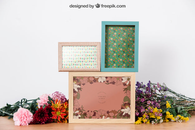 Free Mockup Of Three Frames Between Flowers Psd