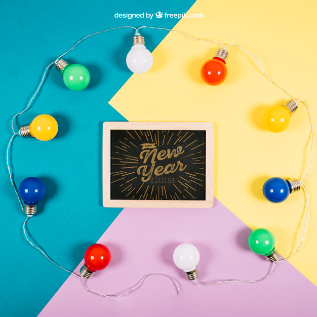 Free New Year Mockup With Slate And Bulbs Psd