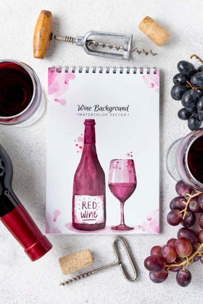 Free Notebook With Wine Bottle On Table Psd