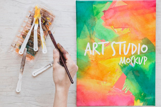 Free Painting Watercolors And Brushes On Desk Psd