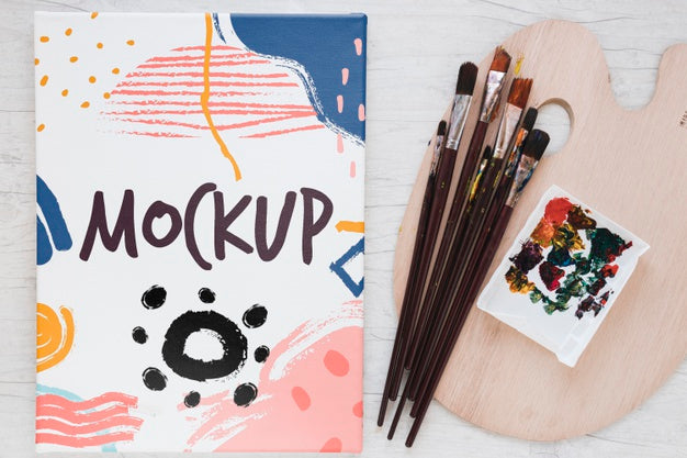 Free Painting Watercolors And Brushes On Table Psd