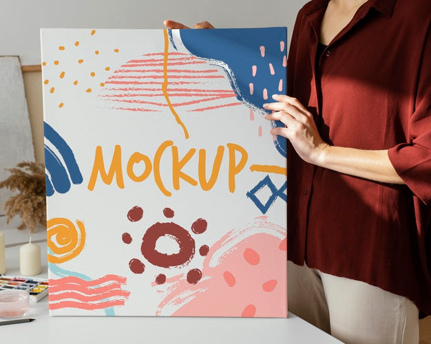 Free Person Holding A Canvas Mock-Up Psd