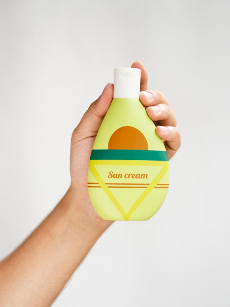 Free Person Holding A Sun Cream Bottle Psd