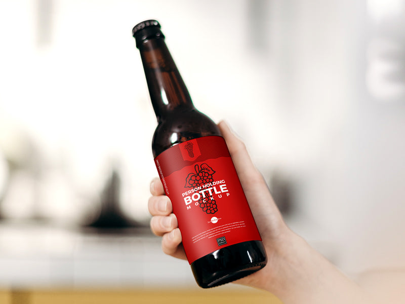 Free Person Holding Bottle Mockup