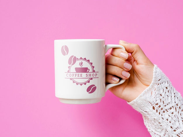 Free Person Holding White Mug Mock-Up On Pink Background Psd