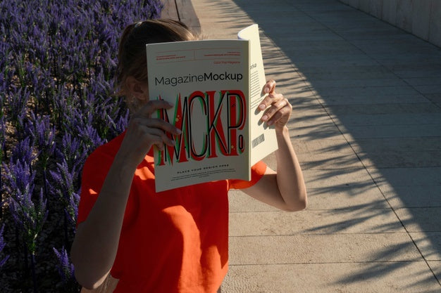 Free Person Reading Color Pop Magazine With Cover Mockup Psd