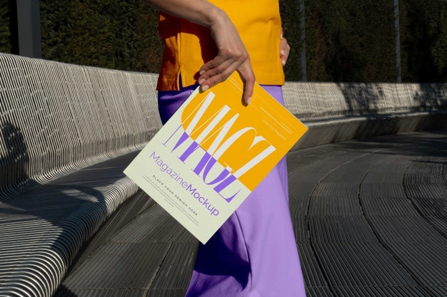 Free Person Reading Color Pop Magazine With Cover Mockup Psd