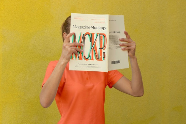Free Person Reading Color Pop Magazine With Cover Mockup Psd