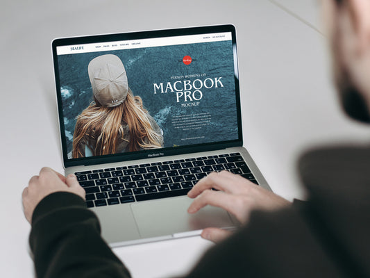 Free Person Working On Macbook Pro Mockup