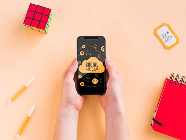 Free Phone On Desk Beside Rubik Cube Psd