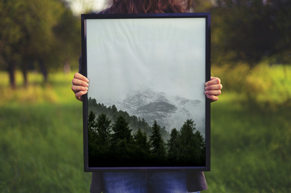 Free Women Holding a Poster Frame Mockup