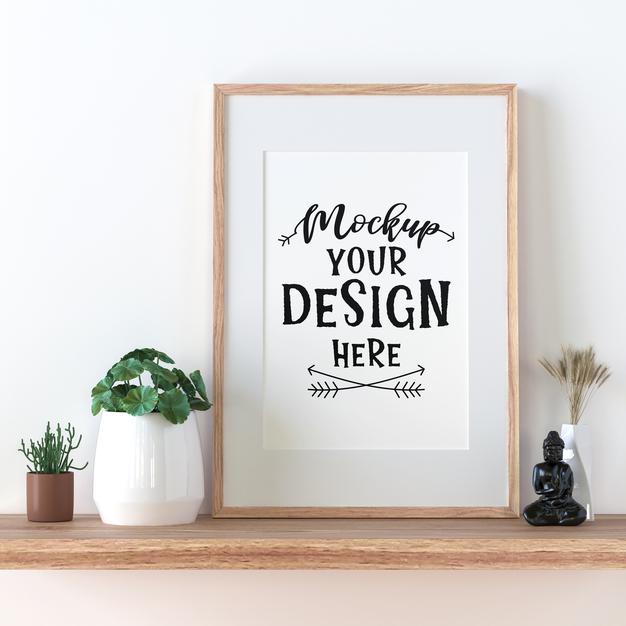 Free Poster Frame Mockup On The Wall With Plant Psd