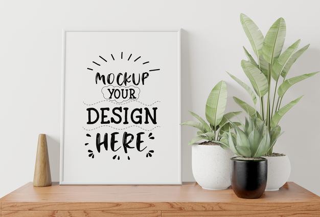 Free Poster Frame Mockup On The Wall With Plant Psd