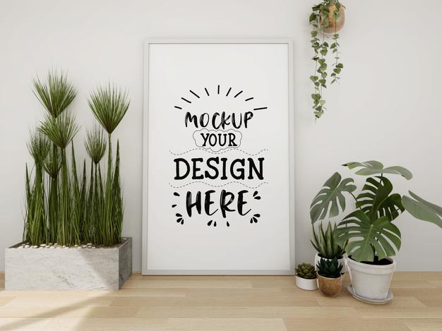 Free Poster Frame Mockup On The Wall With Plant Psd