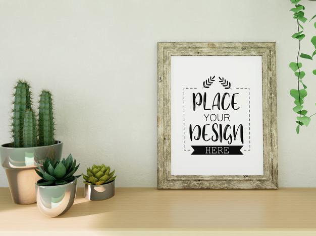 Free Poster Frame Mockup On The Wall With Plant Psd