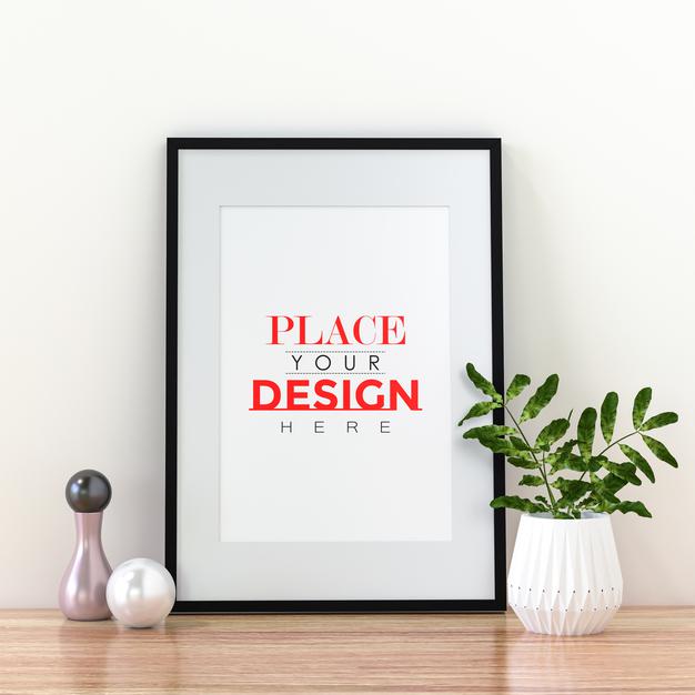 Free Poster Frame Mockup On The Wall With Plant Psd