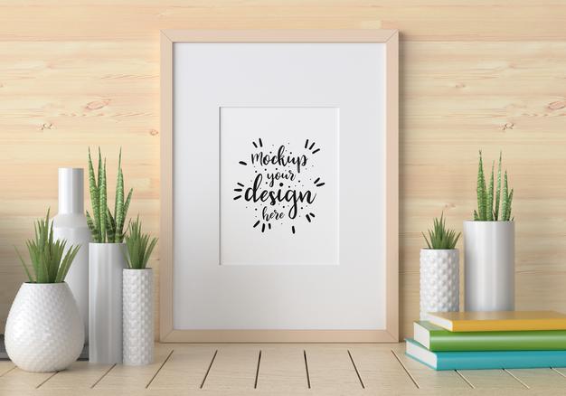 Free Poster Frame Mockup On The Wall With Plant Psd