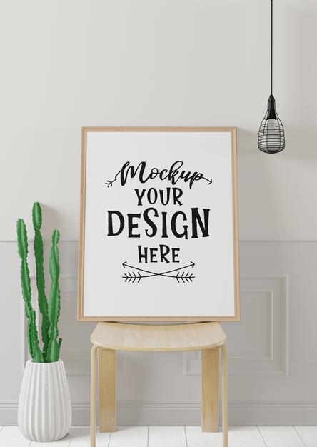 Free Poster Frame Mockup On The Wall With Plant Psd