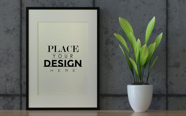 Free Poster Frame Mockup On The Wall With Plant Psd